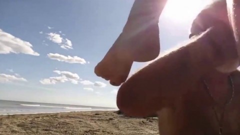 Blonde slut sucks old guys dick on the beach in Florida