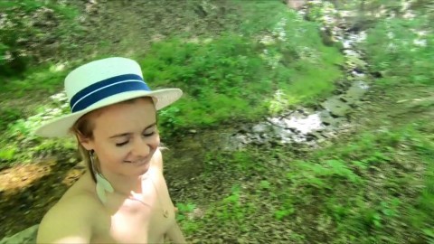 Nudist girl walks in the woods